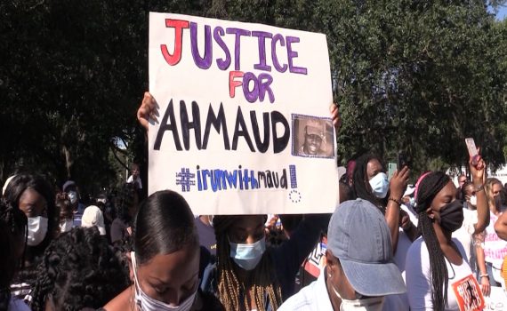 people protesting Ahmaud Arbery’s murder